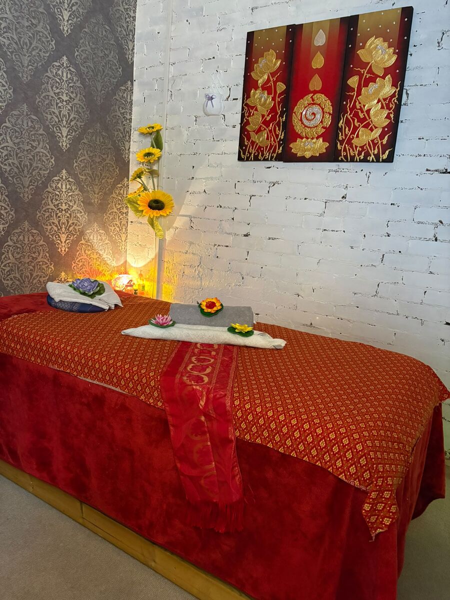 Treatment room at Bann Thai Spa & Massage with traditional Thai fabrics